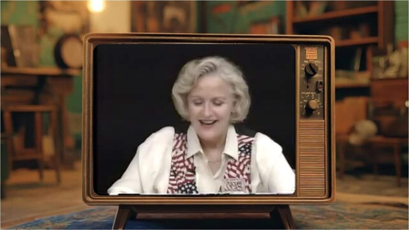 An archival clip plays on a vintage television set.